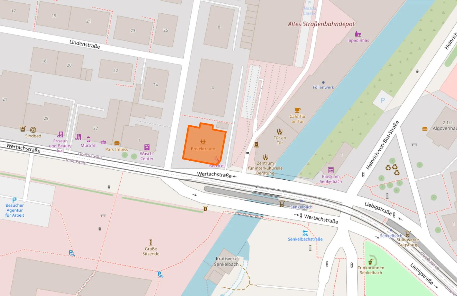 Lagekarte des Projektraums an der Ecke Wolfgangstraße/Wertachstraße in Augsburg; das Gebäude ist orange hervorgehoben. Nächste Haltestelle: Senkelbach an der Wertachstraße.